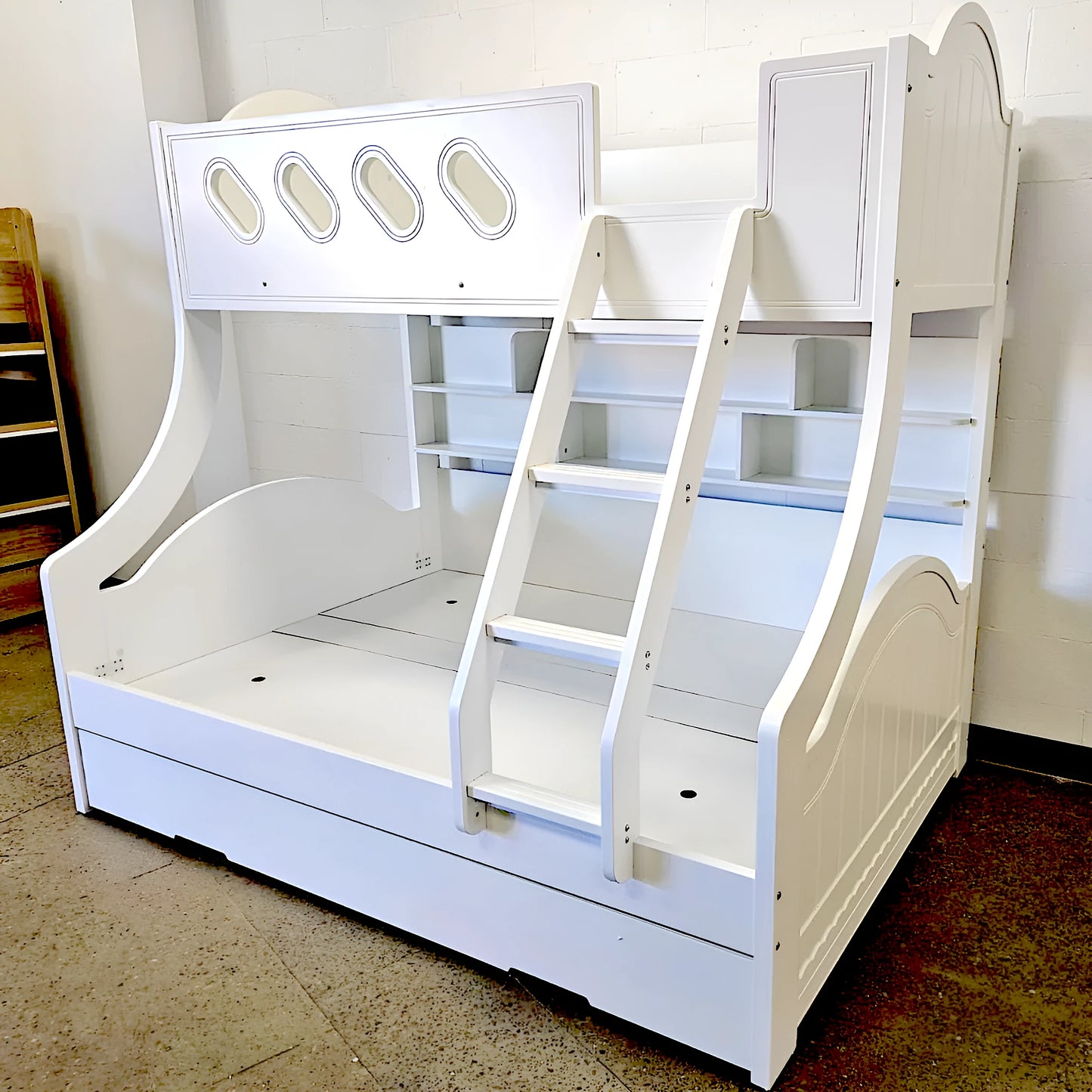 Cloudy bunk bed in white with built in bookshelf and trundle