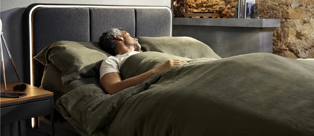 person relaxing on ergodynamic adjustable bed