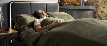 person relaxing on ergodynamic adjustable bed