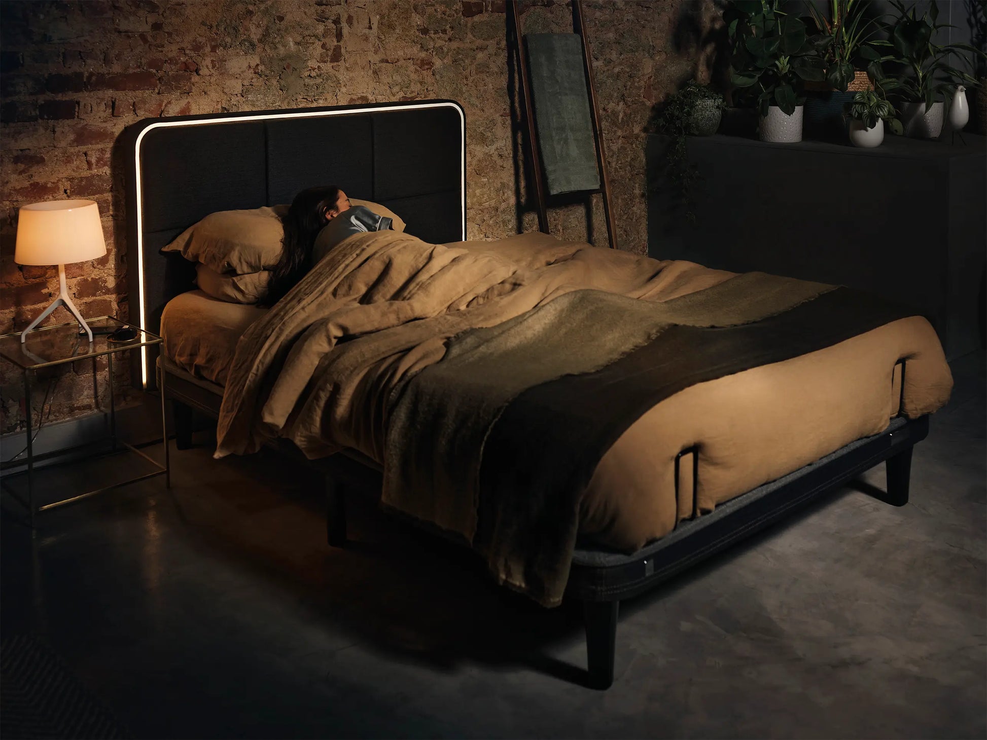 person sleeping on ergodynamic adjustable bed
