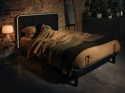 person sleeping on ergodynamic adjustable bed